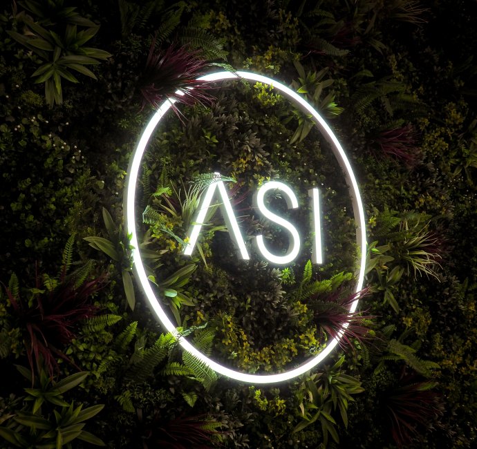 Neon ASI sign green wall