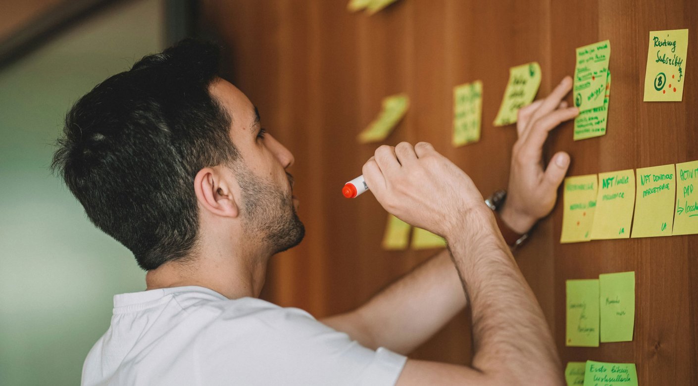 Man with post-it notes on a wall