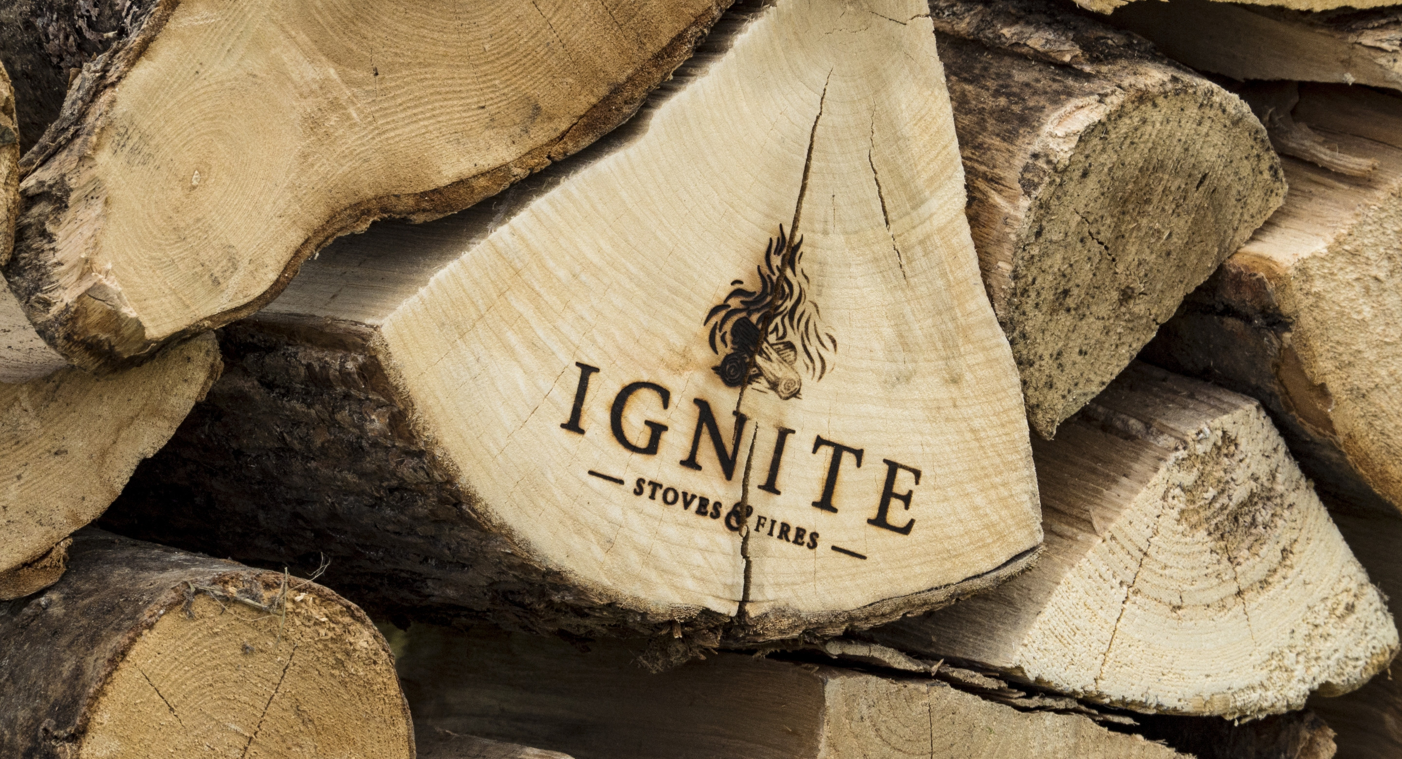 Ignite Stoves burning log flames logo design by Root Studio