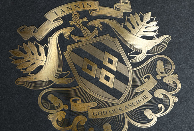 Tannis family crest shield whale design by Root Studio