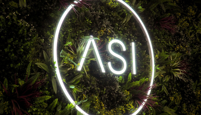 Green wall with neon sign