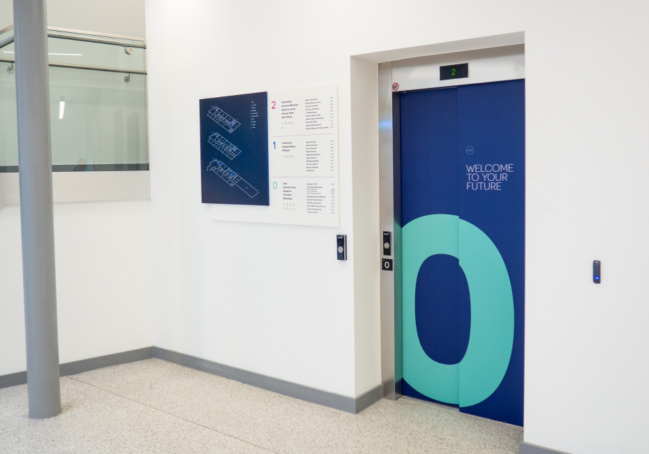ASI College wayfinding lift door graphic signage 2
