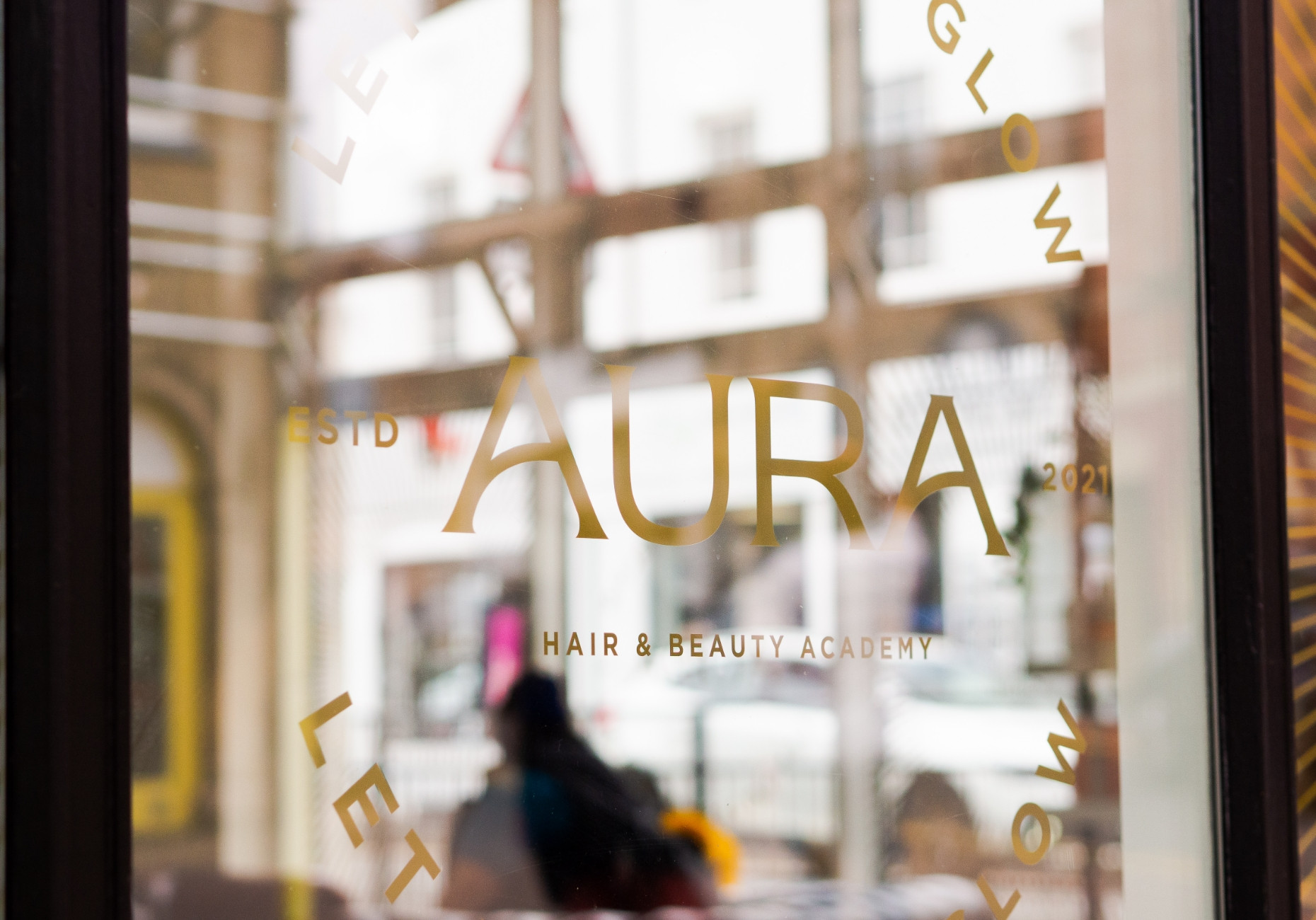 AURA Hair & Beauty logo gold window graphics design by Root Studio